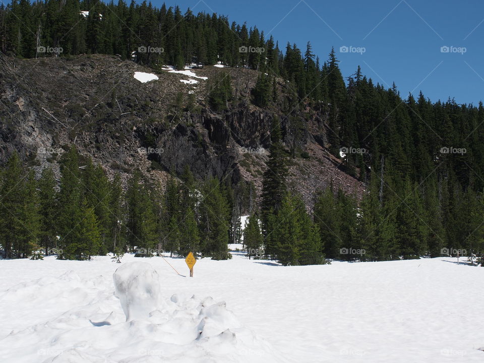 Deep snow remains high up in Oregon’s Cascade Mountains even in June on a sunny summer day. 