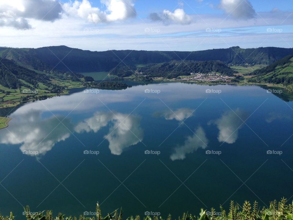 Marvelous lake with blu color and cloud reflections in azores