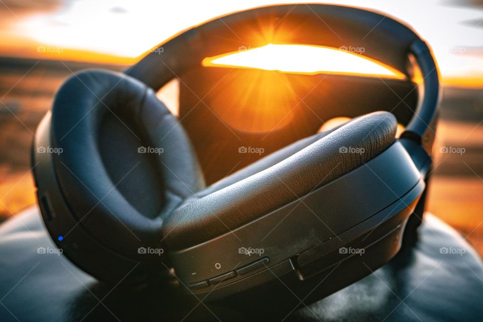 Lens flare over and around earphones.