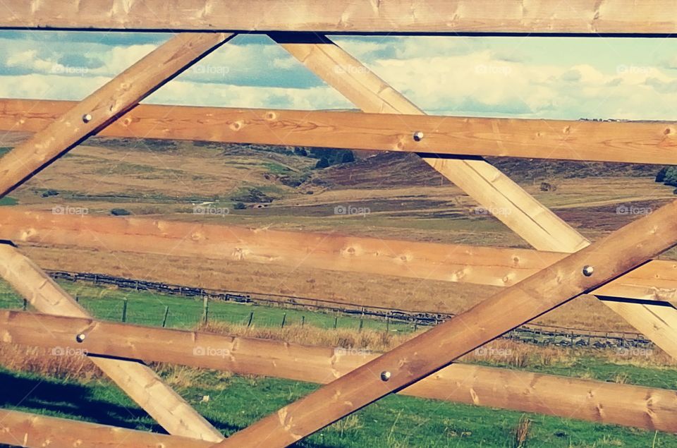 landscape through a wooden gate