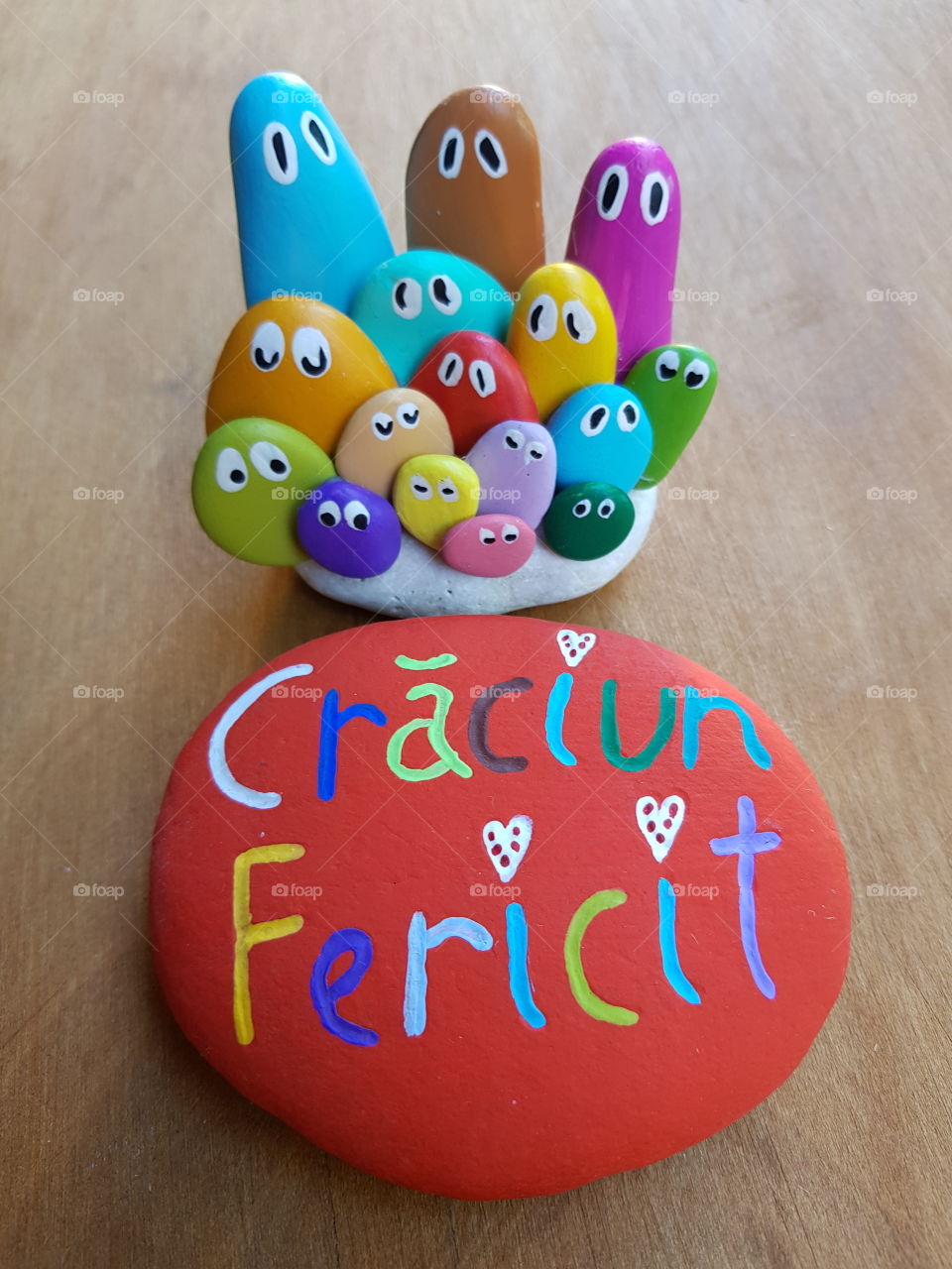 Craciun Fericit, romanian Merry Christmas with colored stones and pebbles 