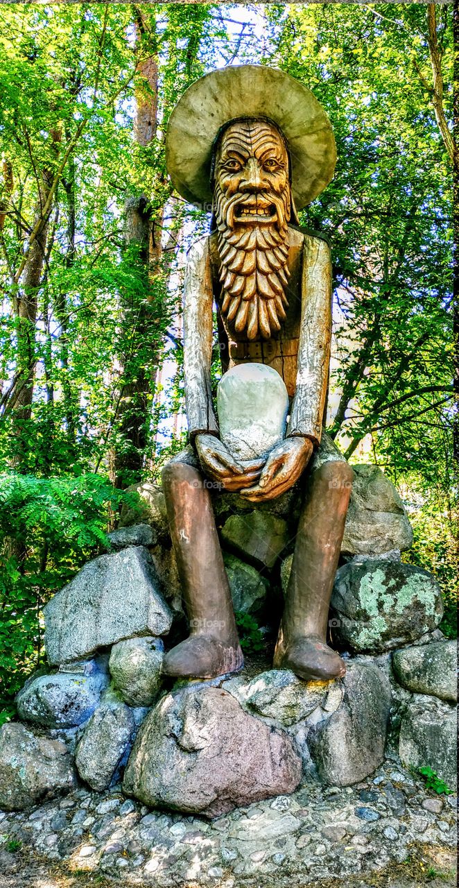 Old sorcerer. City of wooden sculptures, sculptor Chesnulis. (Lithuania, July, 2019).