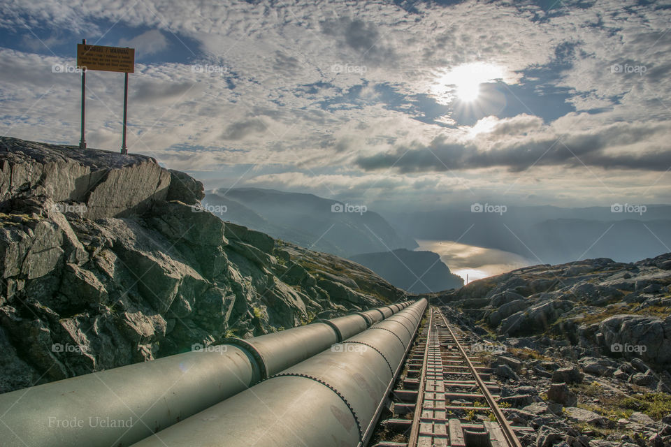 Empty rail track near pipeline