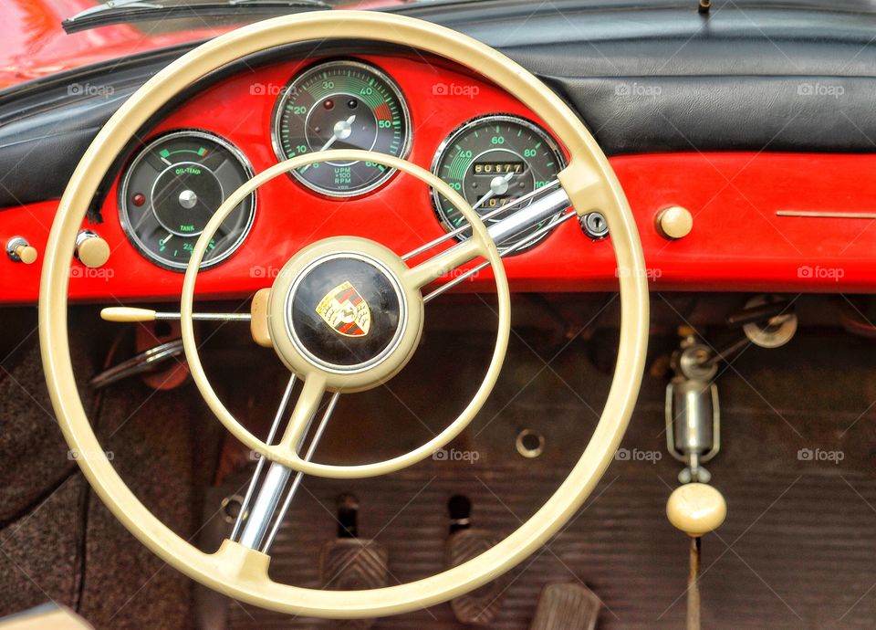 Red  dashboard car stealing wheel