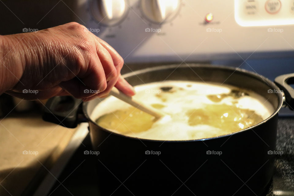 Woman's hand cooking food