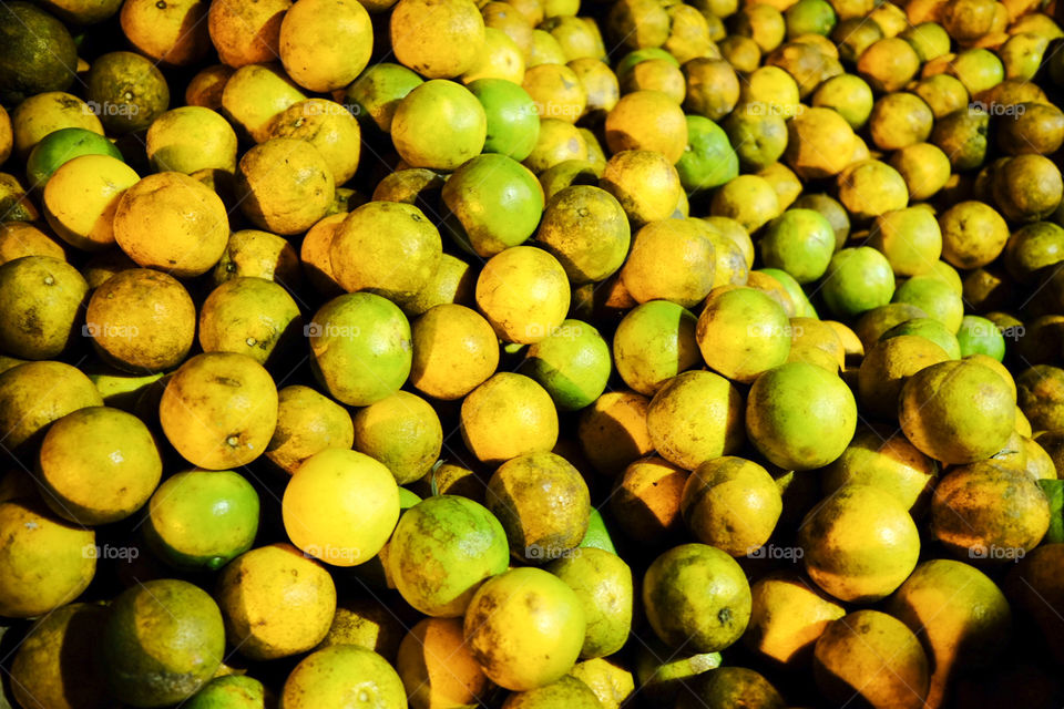 Many oranges at night for sale