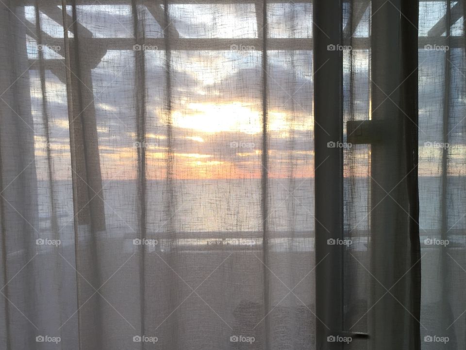 Sunrise through curtains 