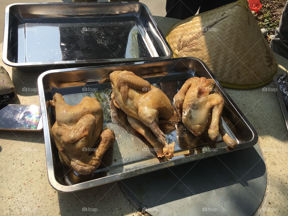 Chicken cooked in earth oven 