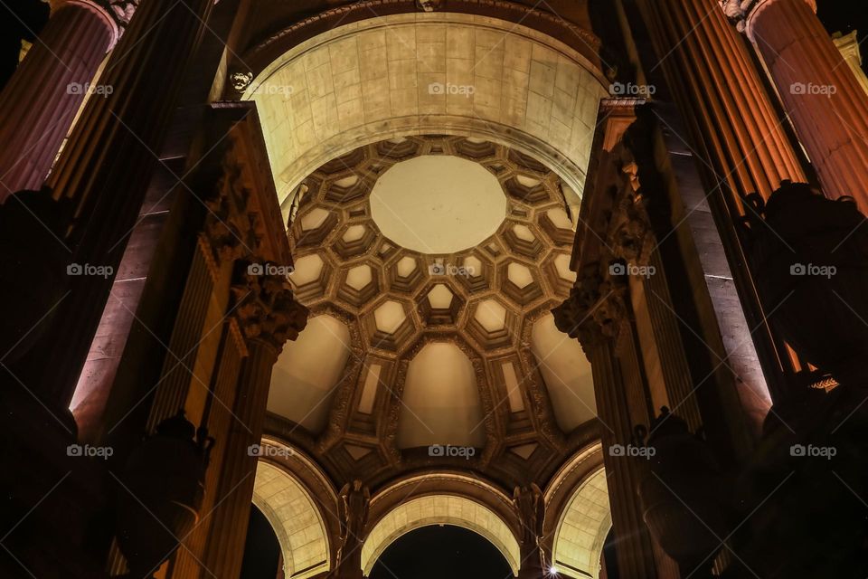 Nighttime at the Palace of Fine Arts in San Francisco California, this beautiful Beaux-Arts designed building by Bernard Maybeck for the 1915 Panama-Pacific International Exposition was meant to resemble Roman Ruins, looking up to the rotunda dome 