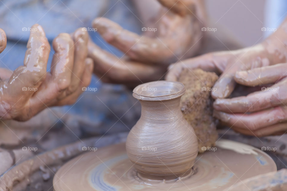 Pottery making. Closeup on hands.