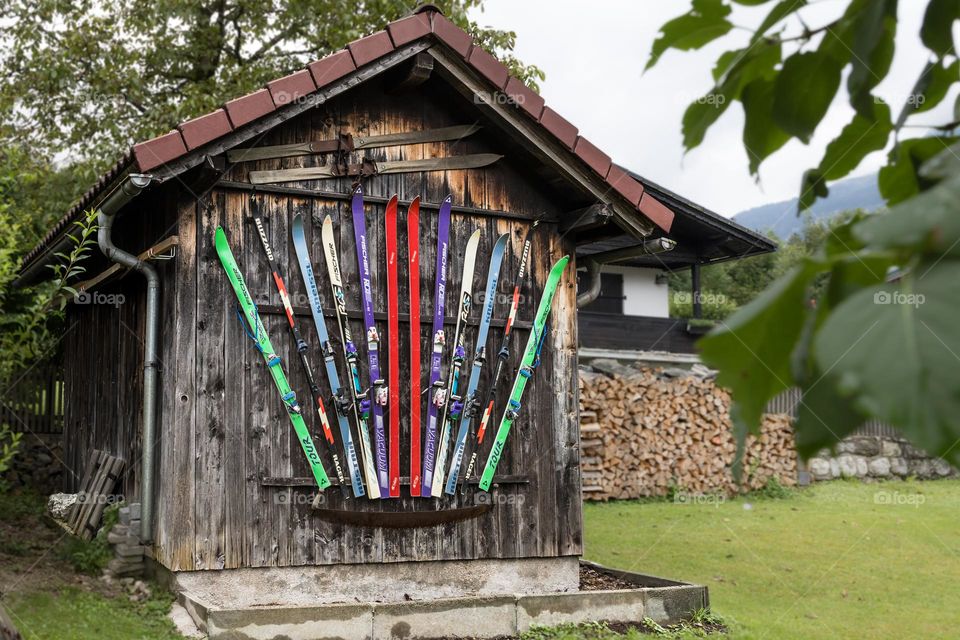 House decorated with skis in different colors 