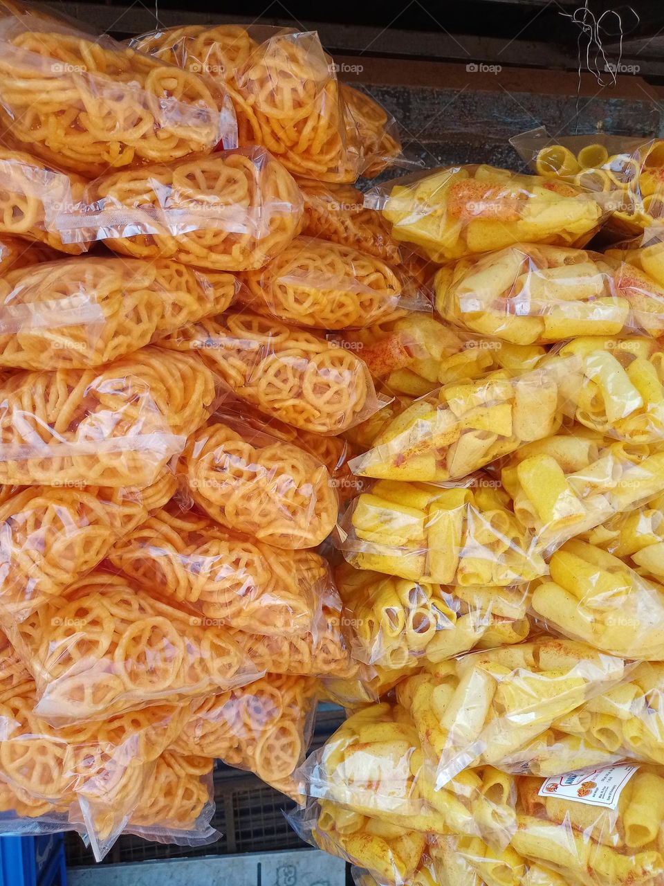 Fresh testi Indian namkeen snacks ready to seal beautiful round shape orenge colour and yellow colour round sticks it's testi