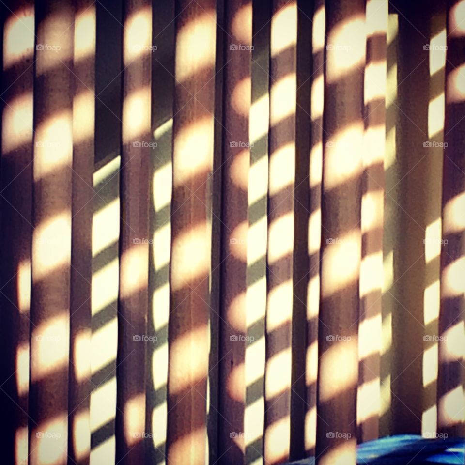 Shadows. Shadows on the spindles of a crib