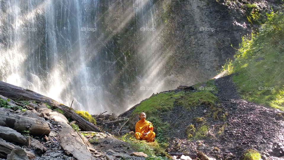 Sunrays behind a Monk at Bridal Veil Falls in B.C.