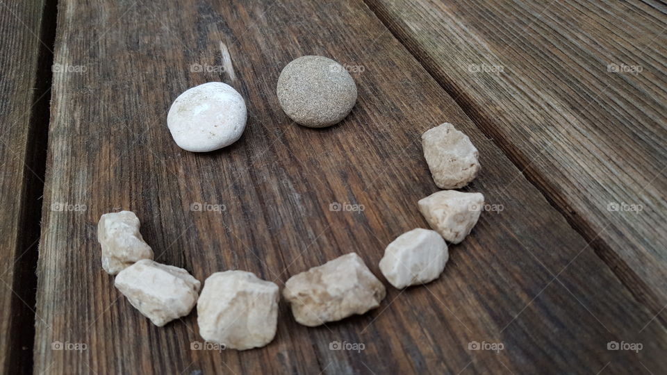 smiley face made with pebbles