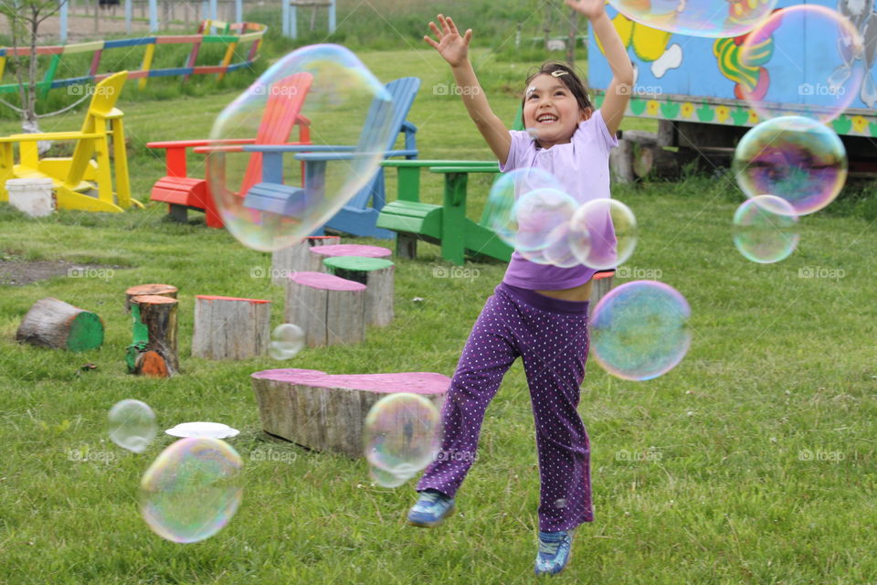 Girl and soapy bubbles