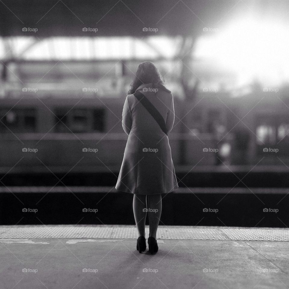 Woman on a Train Station Platform