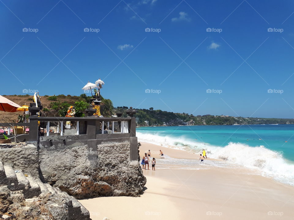 a place of worship on the edge of a rocky beach