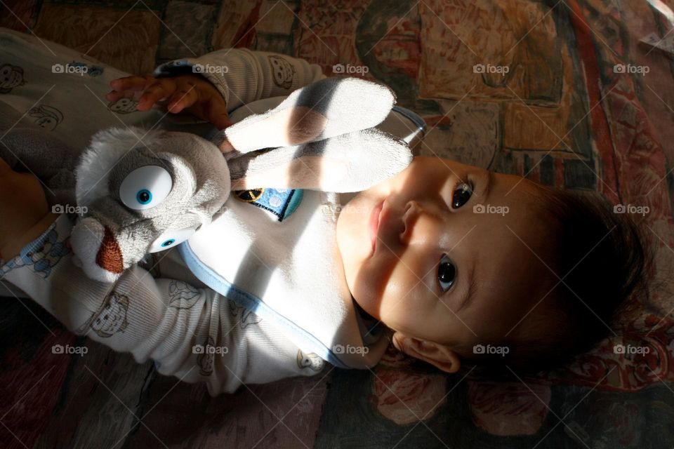 Cutte baby with a plush rabbit