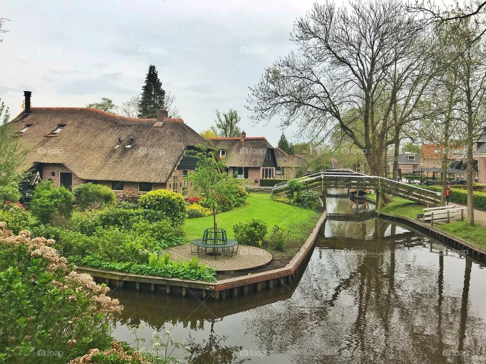 Water canal and houses in Giethoorn, Netherlands 