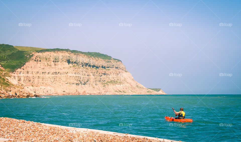 Canoeing along the UK coastline at Rock-a-nore 