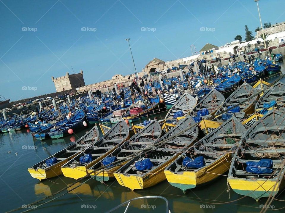 beautiful blue and yellow boats on the harbour at Essaouira city in Morocco,