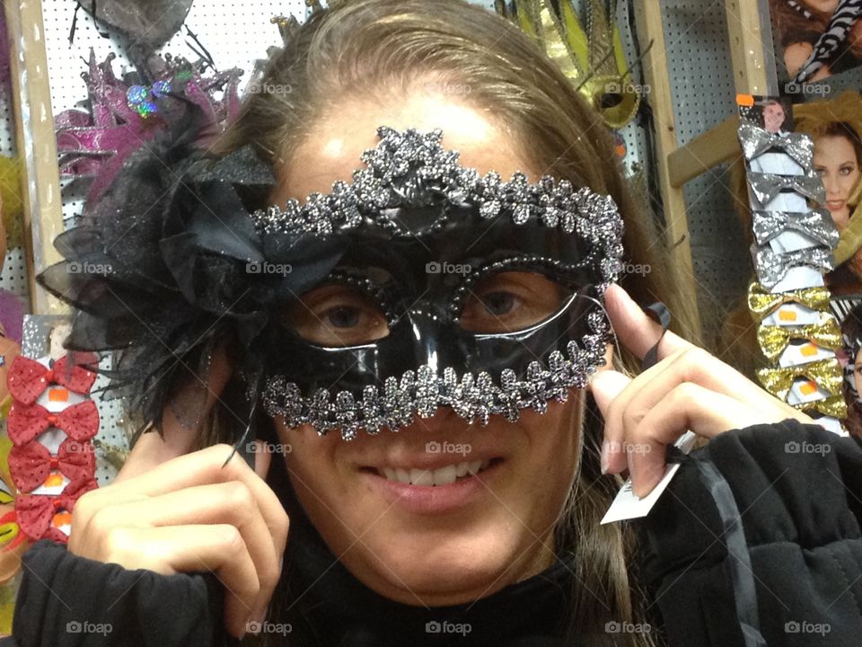 A woman with a masquerade mask