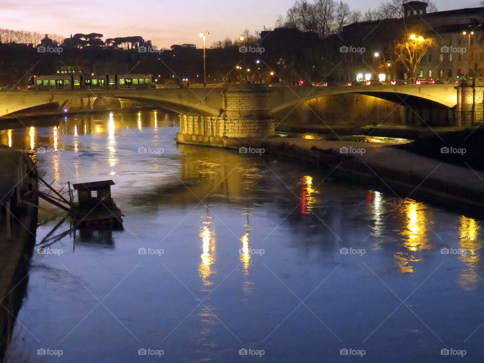 city river with boat and light reflection by night