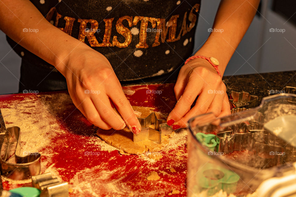 girl is baking christmas cookies