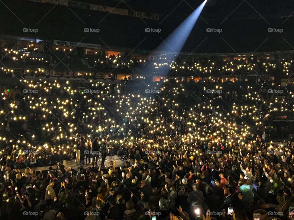 Large Music Concert with Lit Up Phones in the Crowd 3