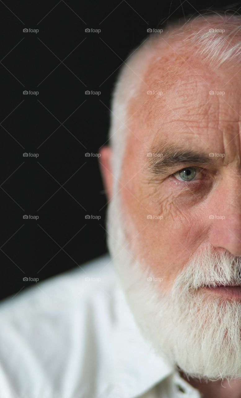 Portrait of an adult, emotions, wrinkles and the history of a person’s life in one portrait. Unique face skin stories