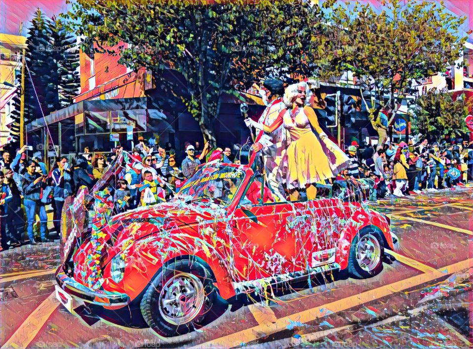 Poster Art - Elvis and Marilyn on Volkswagen Beetle convertible in carnival parade.