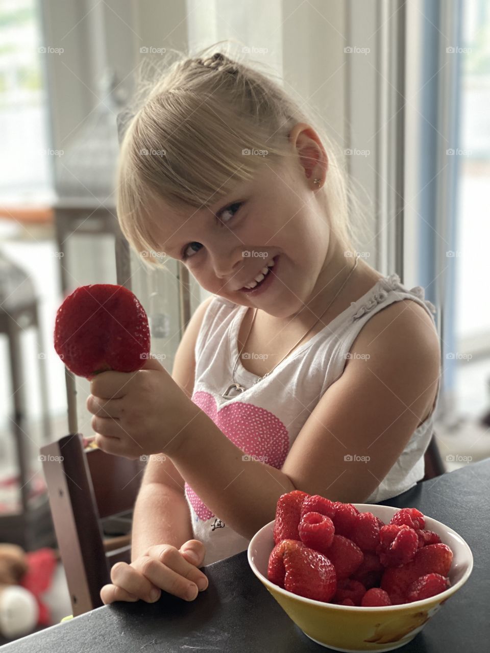 eating strawberries at the table
