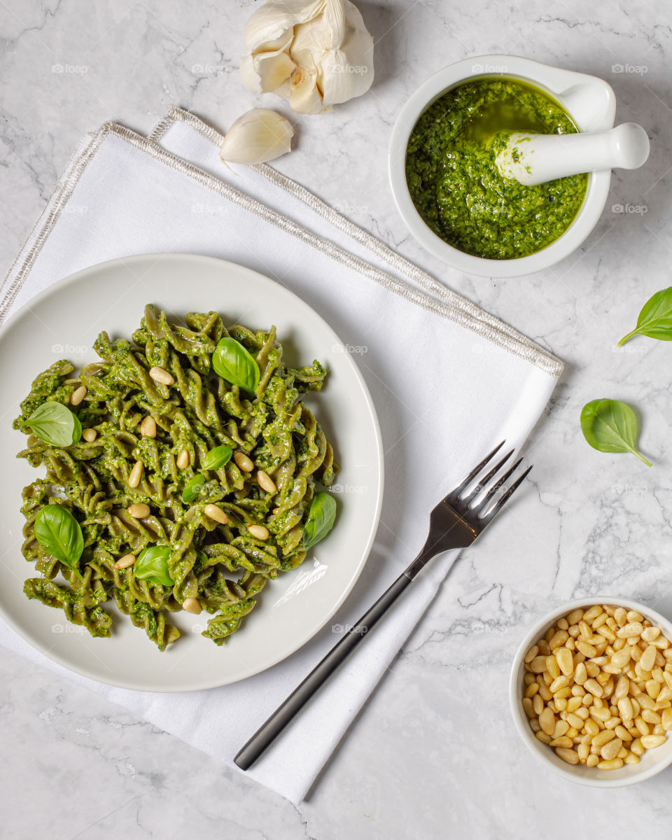 Green wholegrain pasta made of mungo beans with homemade green pesto