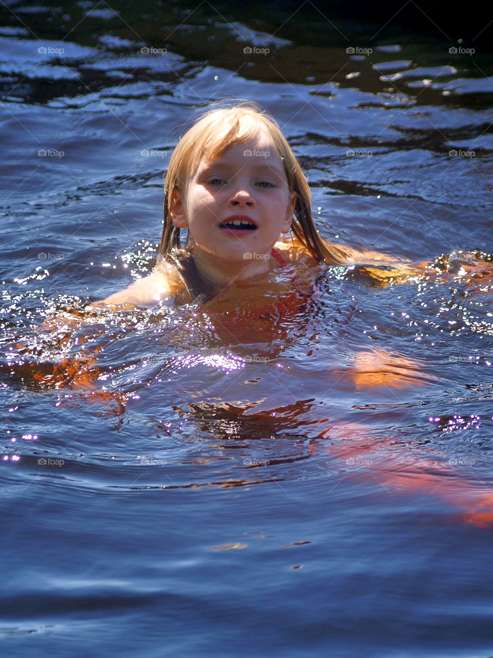 Girl bathing in the lake