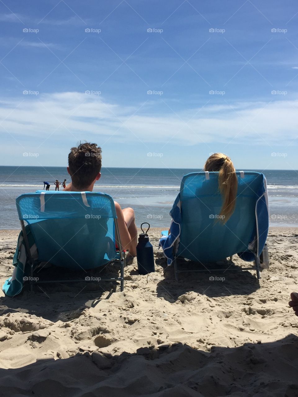 Me and my boyfriend, tanning and listening to the waves at the Outerbanks beach in Corolla.
