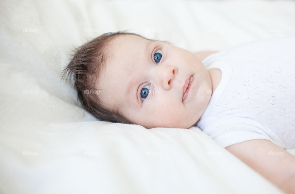 Little infant baby with blue eyes