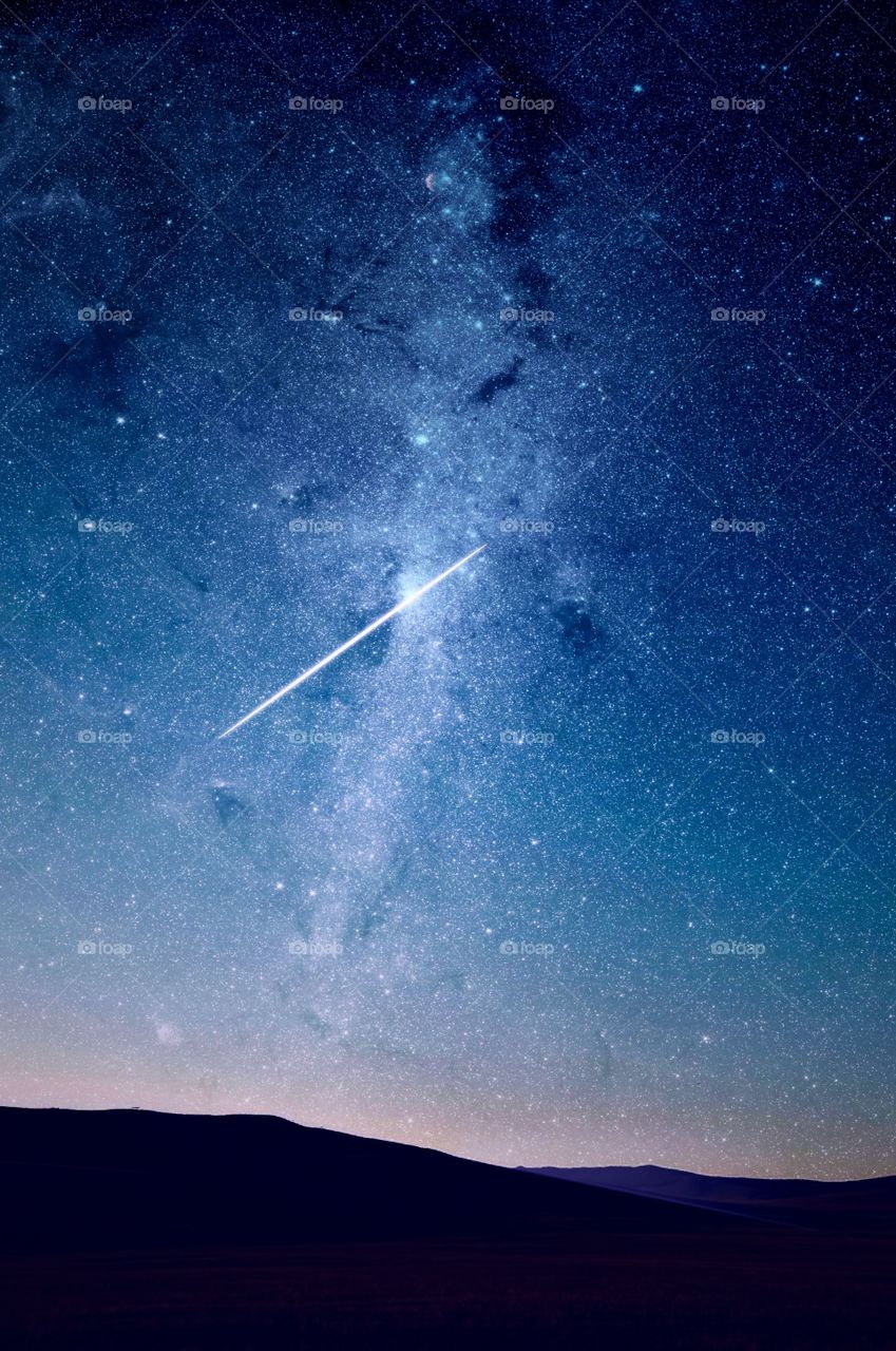aerial view of the star and shooting star in the sky at night