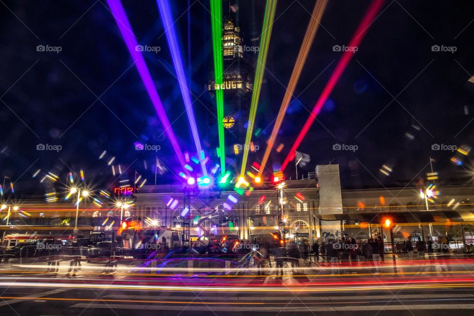 San Francisco pride 2023 light installation of the pride colors looking towards the ferry building as cars zip down the Embarcadero 