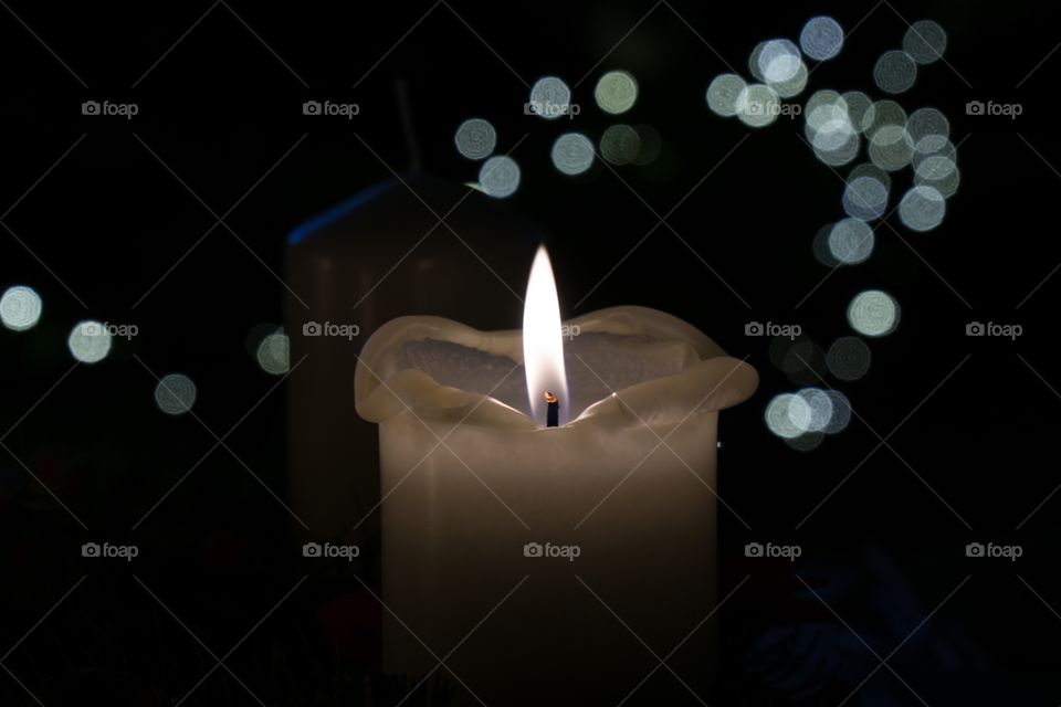 Candle and Christmas lights