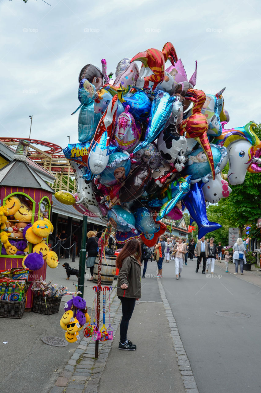 Balloon salesman at the amusement park Bakken in Denmark
