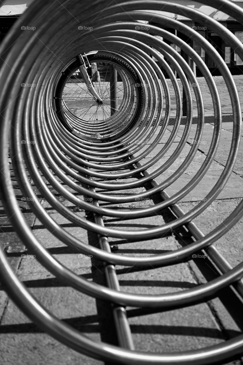 Bike wheel through the circle rack bike parking 