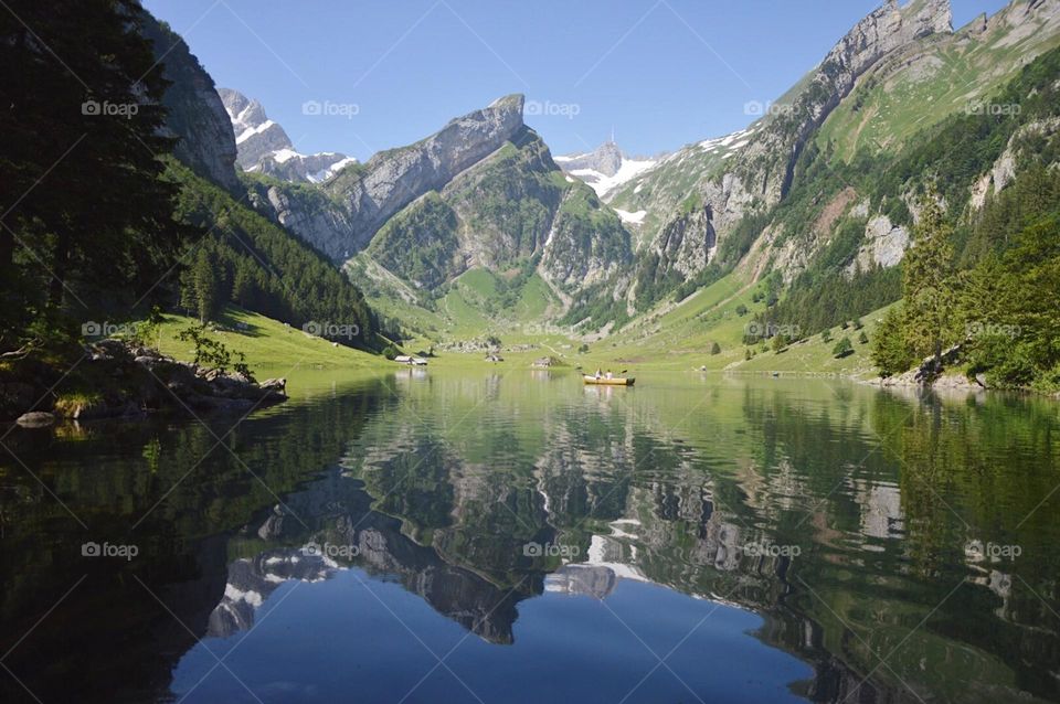 Landscape photo of mountain reflected in lake