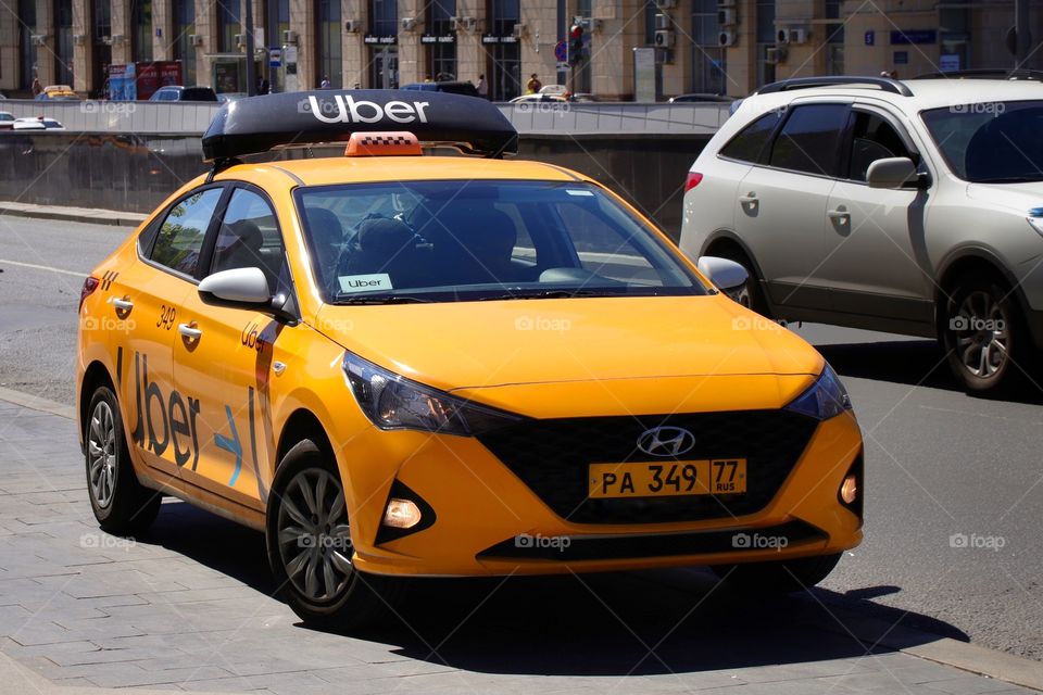 Uber taxi yellow car