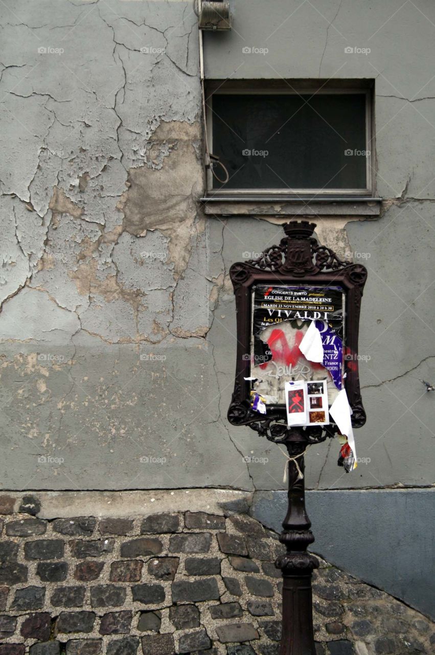 Posters in Paris . Vintage advertisment stand in Montmartre, Paris. 