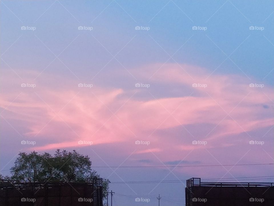 BLUE SKY WITH SOME LIGHT PINK CLOUDS. IT'S SO BEAUTIFUL PICTURE CREATED BY NATURE.
