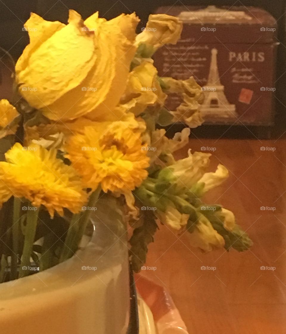 Yellows flowers in the garbage 