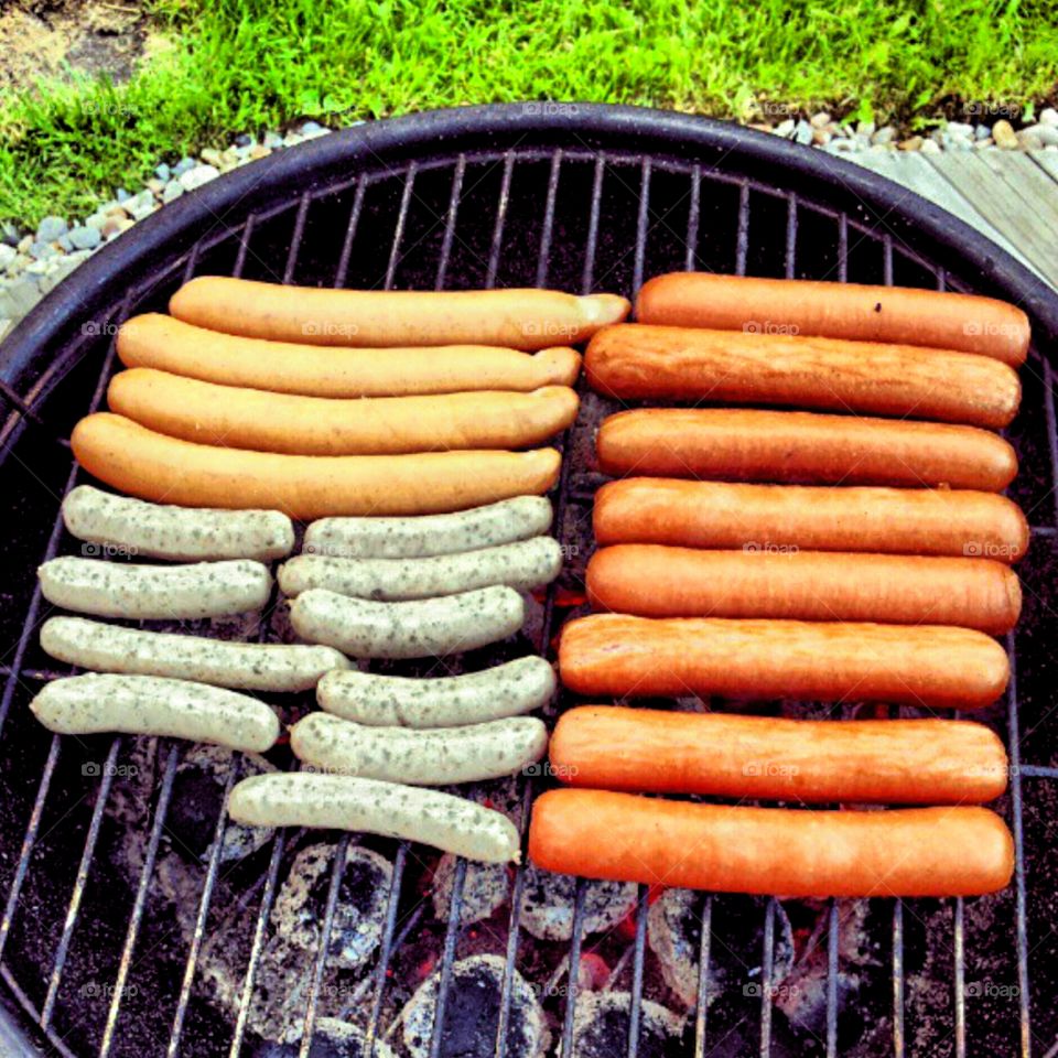 Three kind of sausages, roasted on the charcoal grill on a hot summer day!