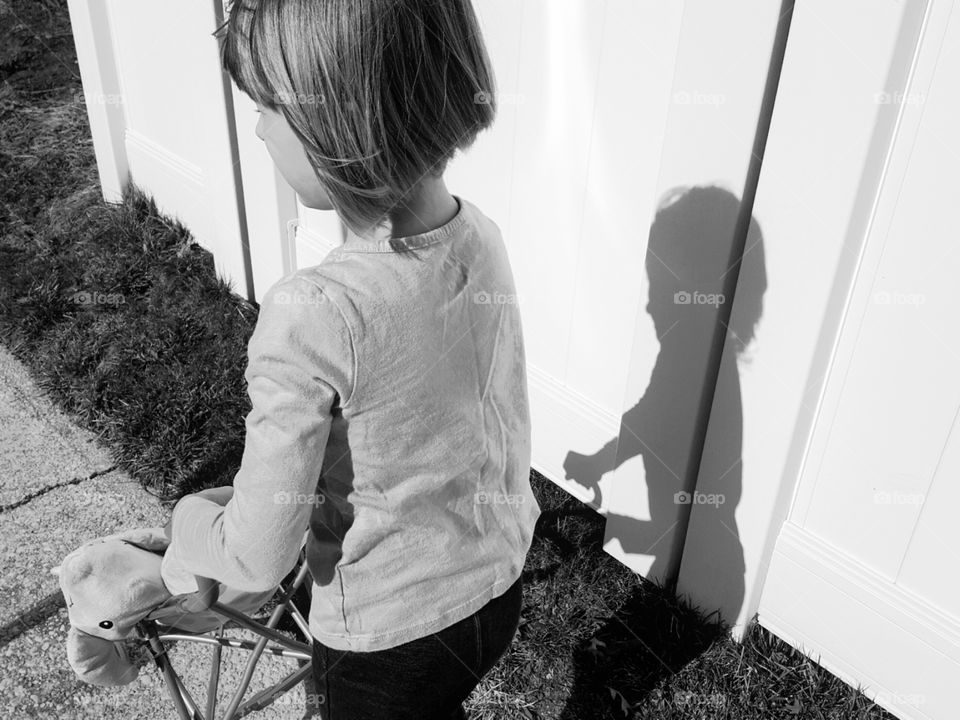 Shadow of Girl on Fence