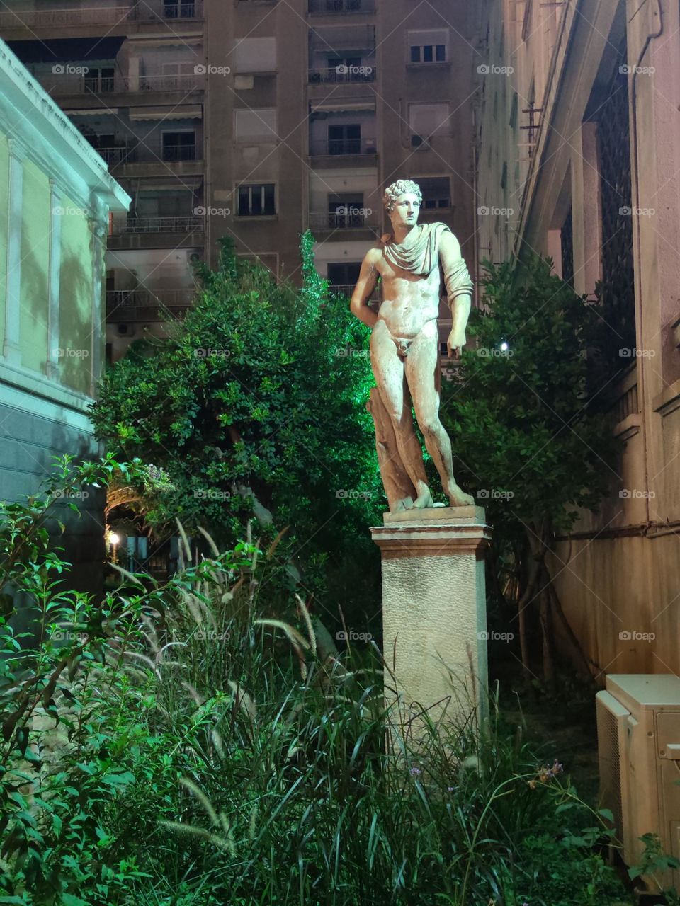 Ancient Greek sculpture in center of Athens city Greece exploring amazing art features summer feeling traveling around Europe